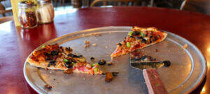 Partly Eaten Tray Of Pizza